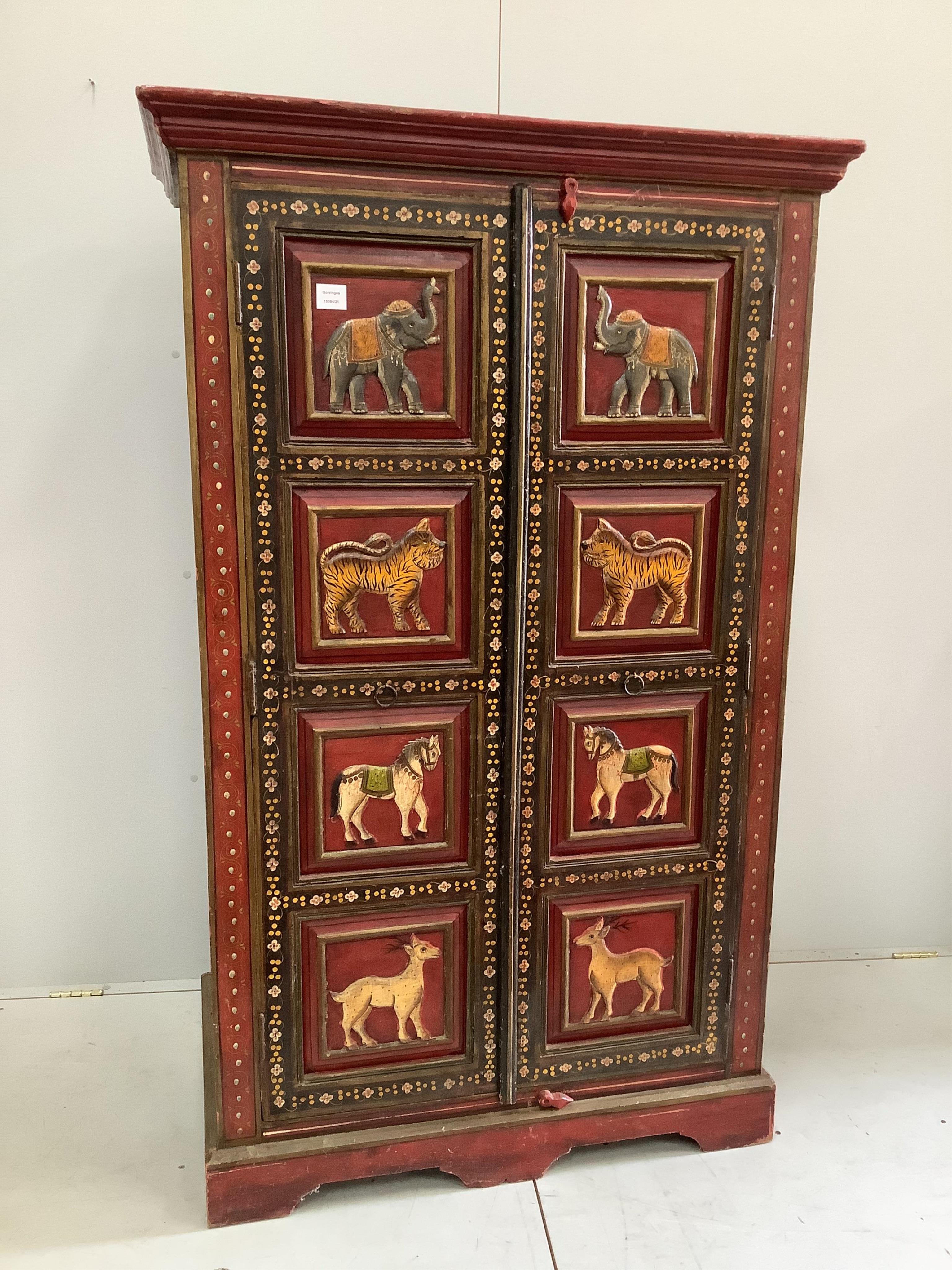 An Indian painted two door hall cupboard, width 100cm, depth 60cm, height 164cm. Condition - fair